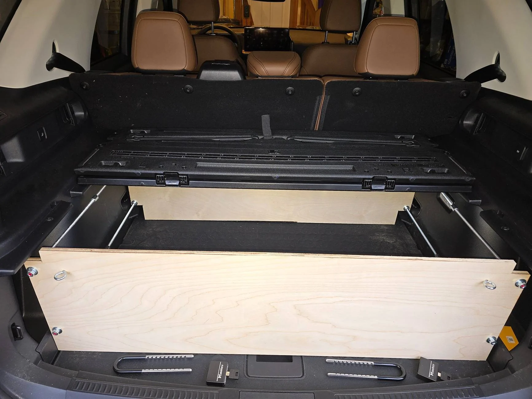 Ford Bronco Sport Adding Locking Storage under the Cargo Management System Cover, locking the top down 20250222_164817[1]