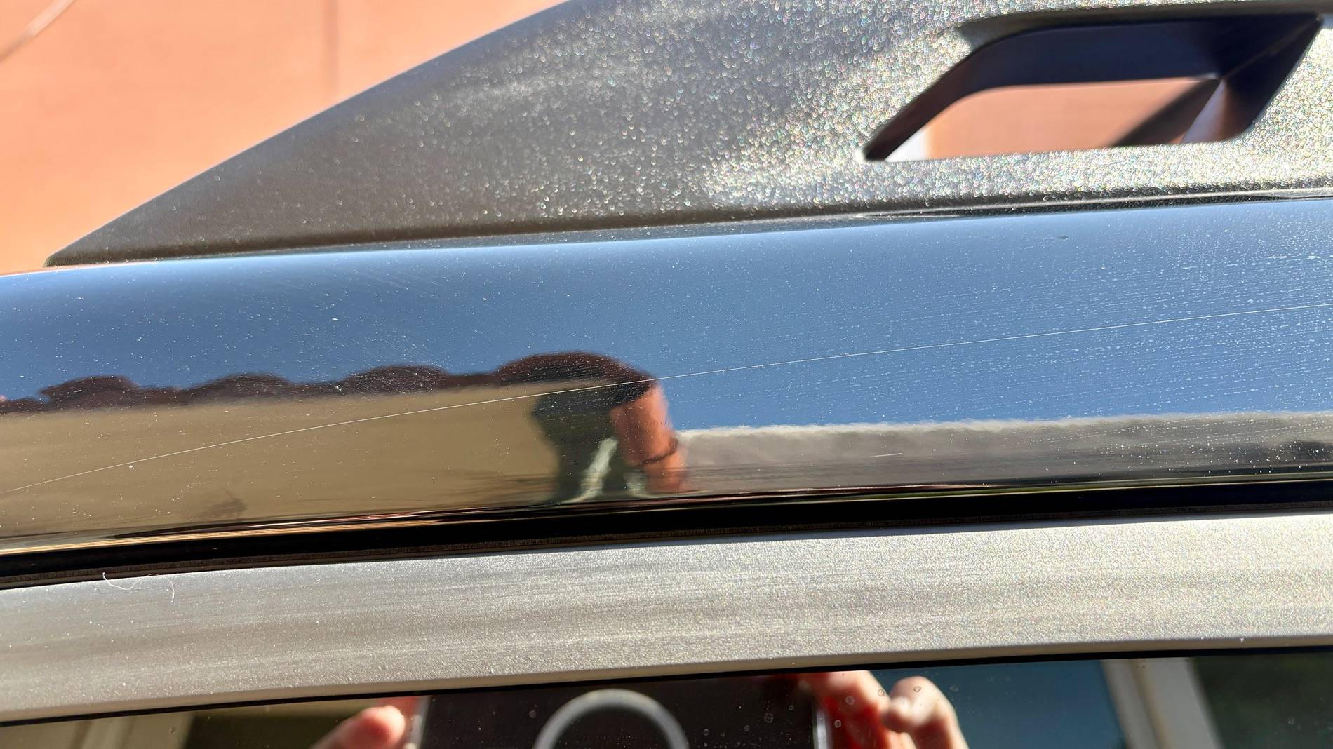 Ford Bronco Sport Bronco Sport Badlands (2025) Hairline SCRATCH on black glass above driver's side door IMG_7903